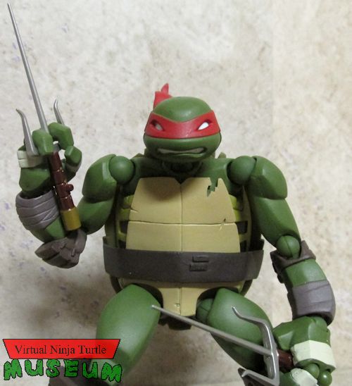 Raphael holding sais